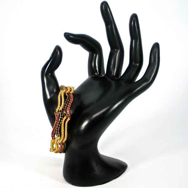 wavy bangles with colored stones